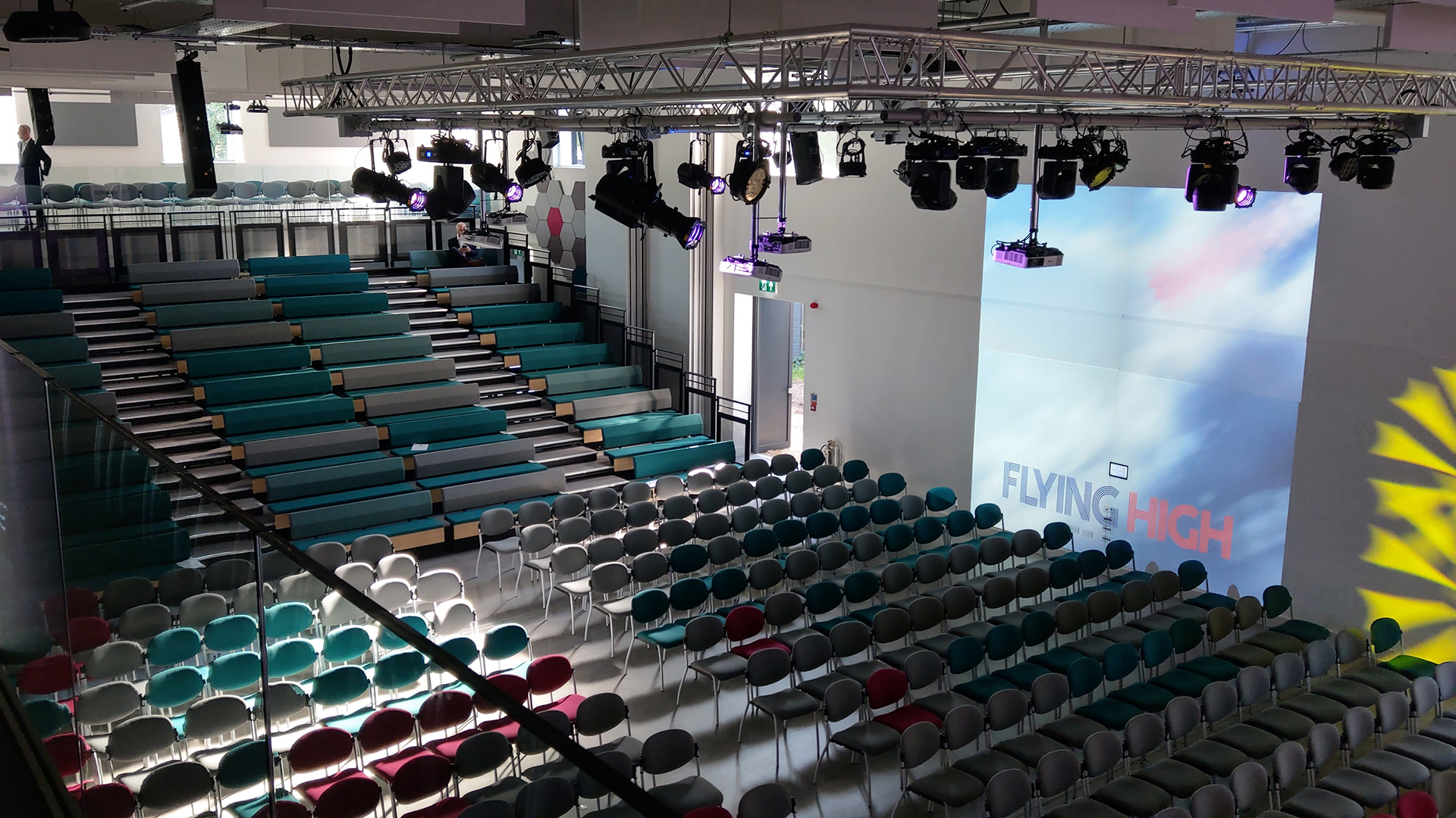 interior main theatre view from side with levels seating and lights on ceiling