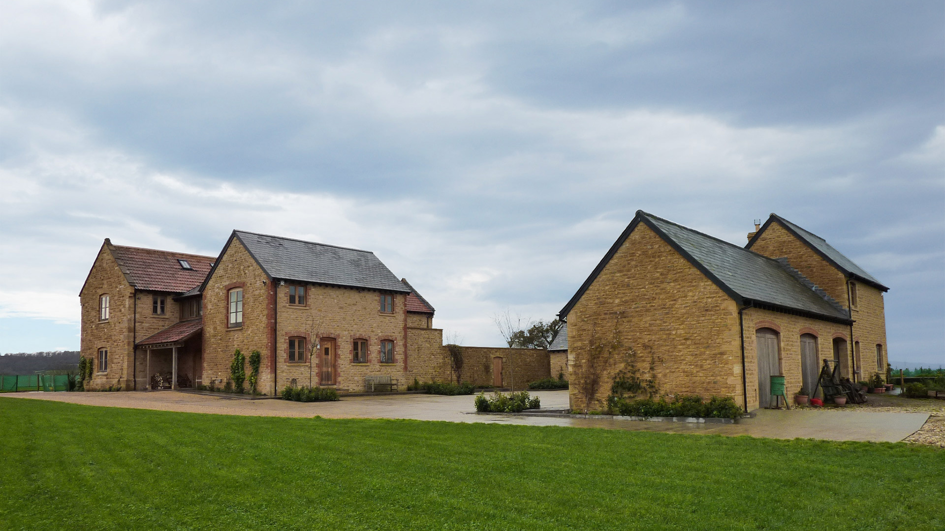 Large beautiful stone farmhouse with outbuilding