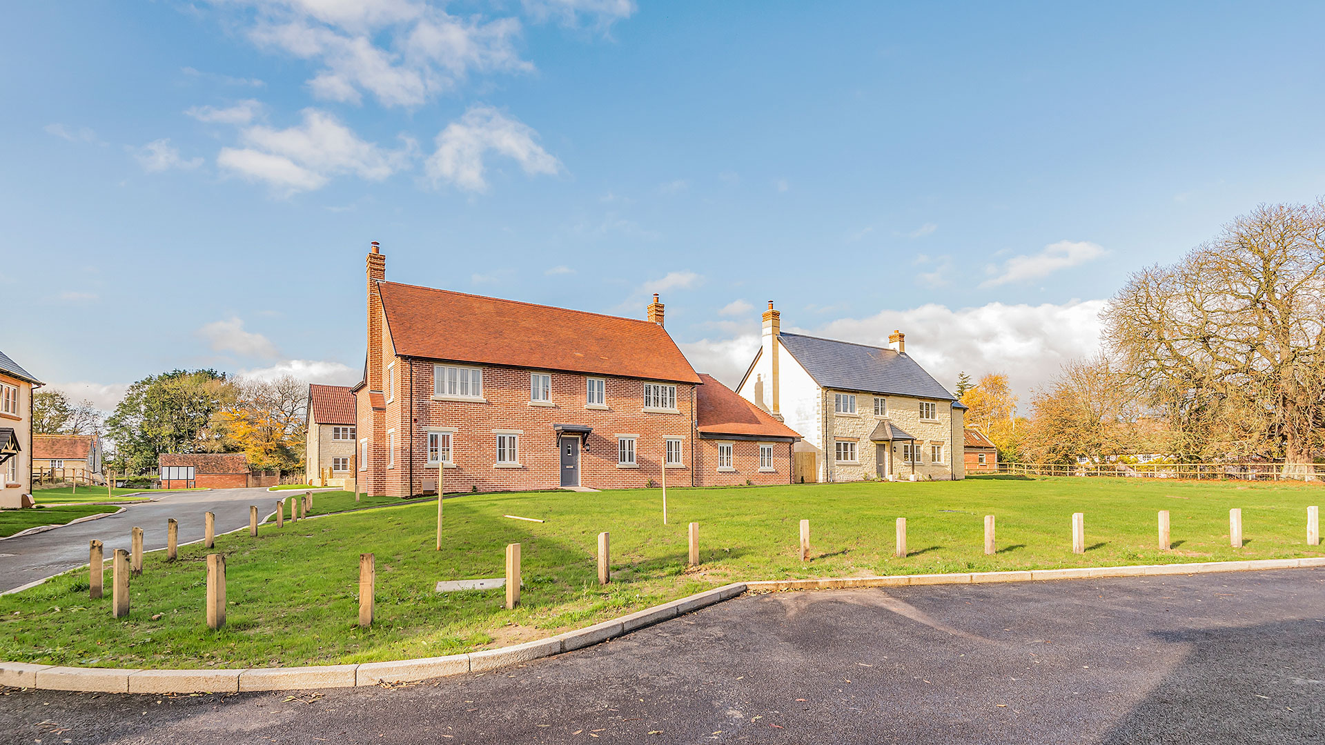 village green with new build houses behind