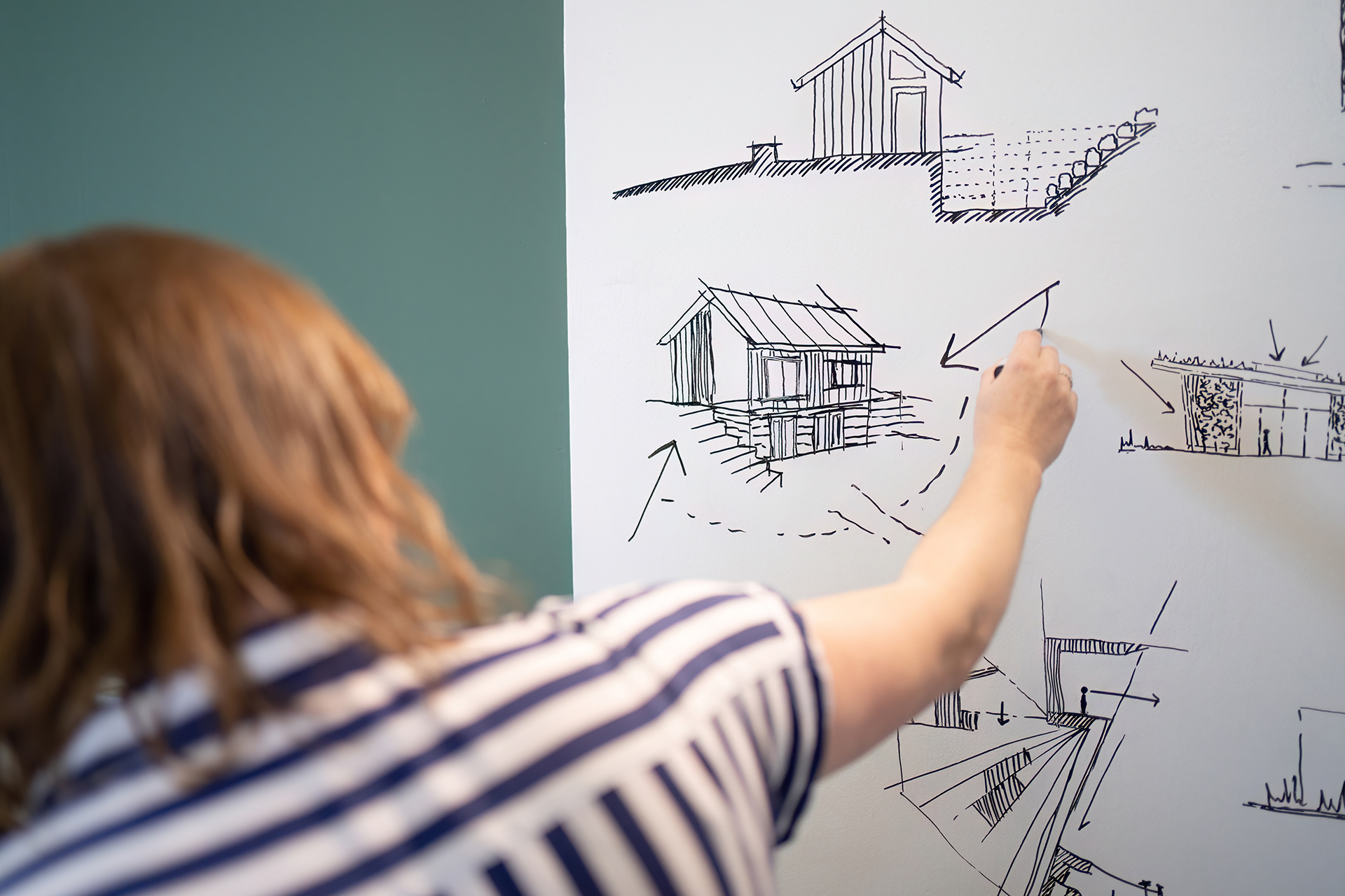 Lady drawing on whiteboard