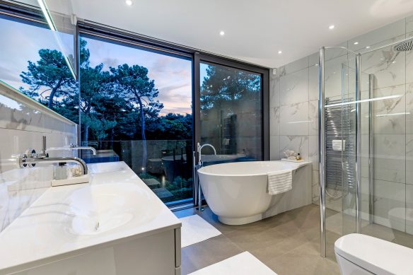 Modern bathroom with tree views