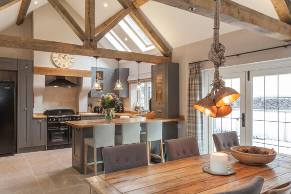 Large kitchen with ceiling beams exposed