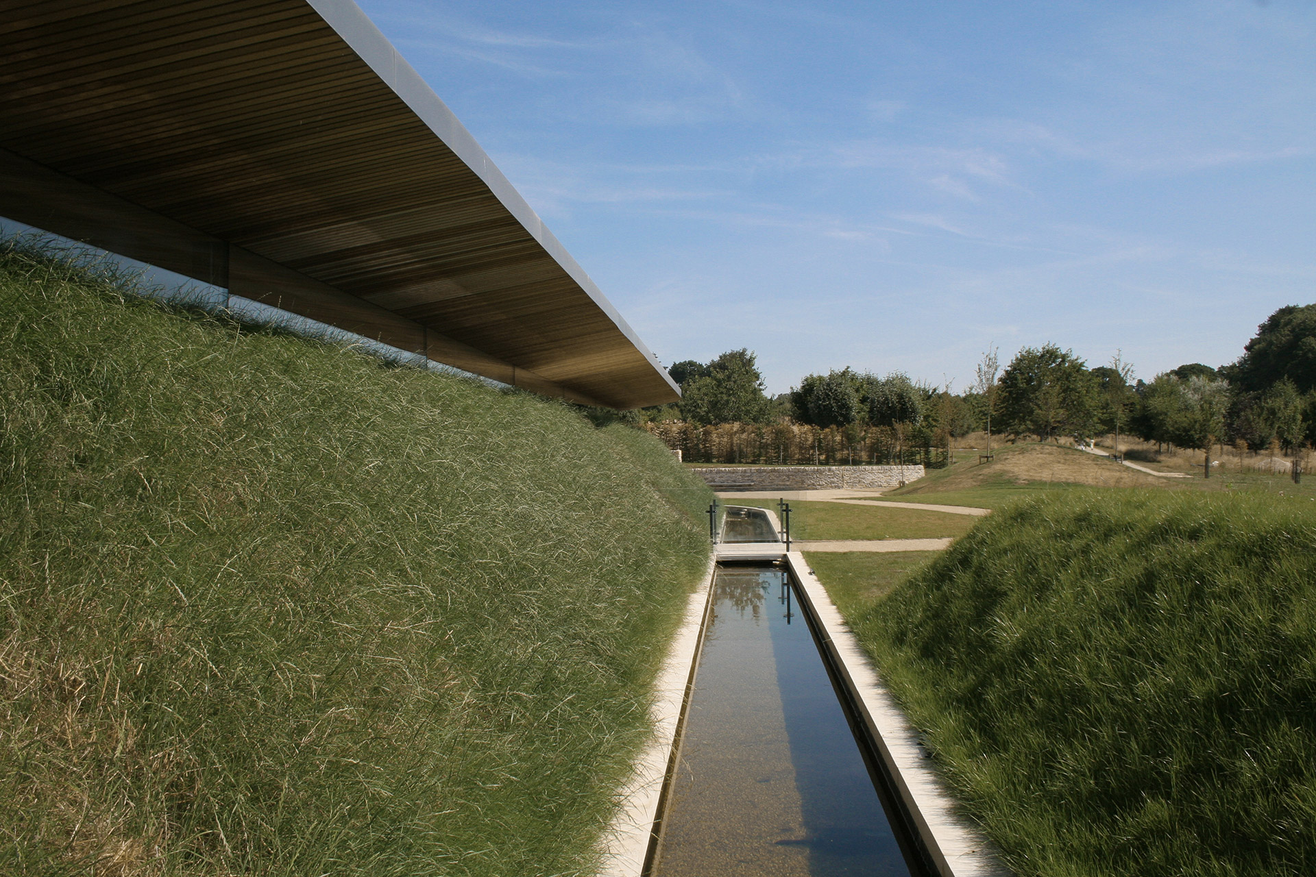 Moat around crematorium with walkway over water