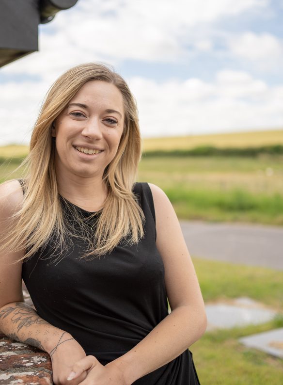 Lucy Park, woman leaning against wall smiling