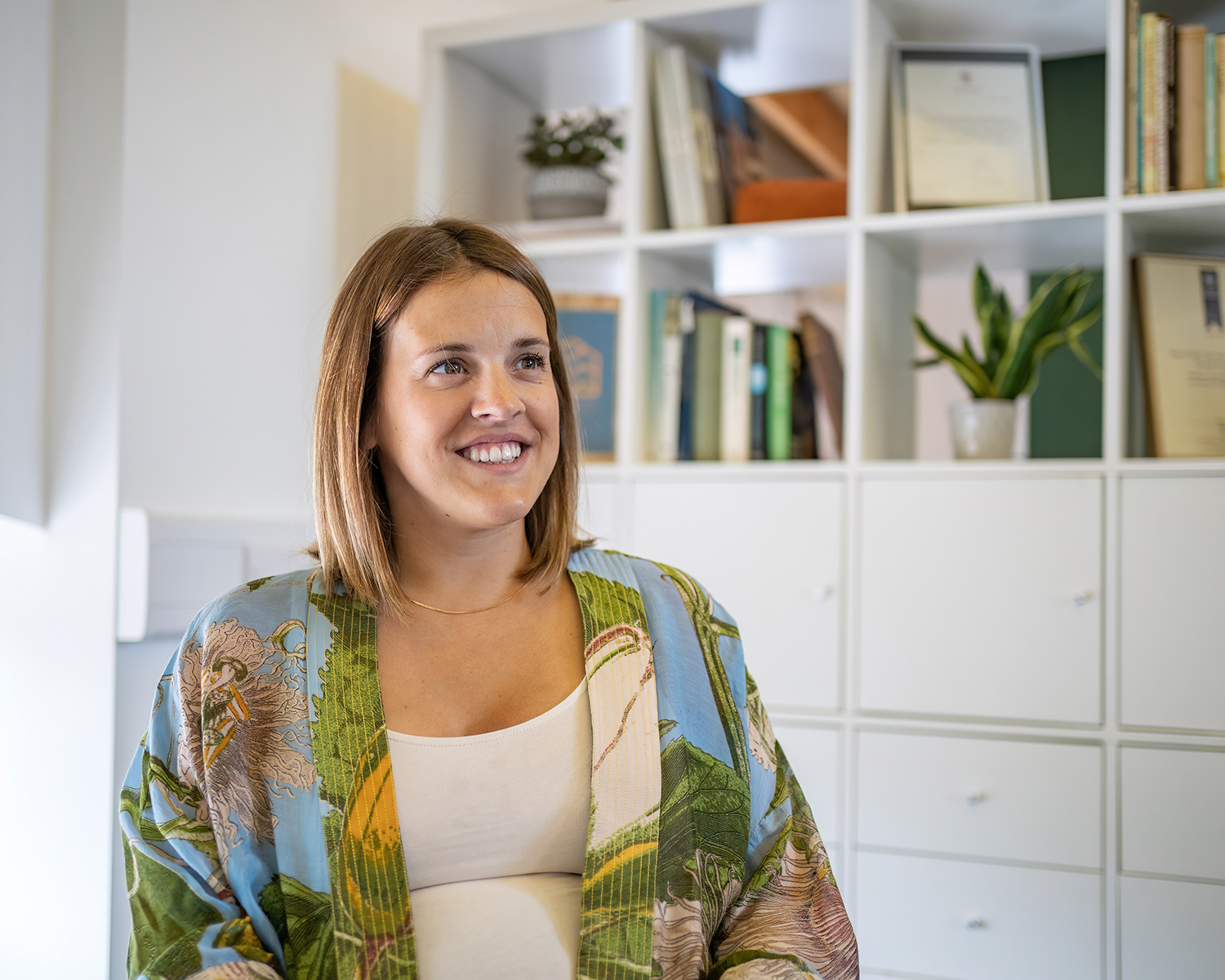 Rachel Cheer, woman sat down smiling