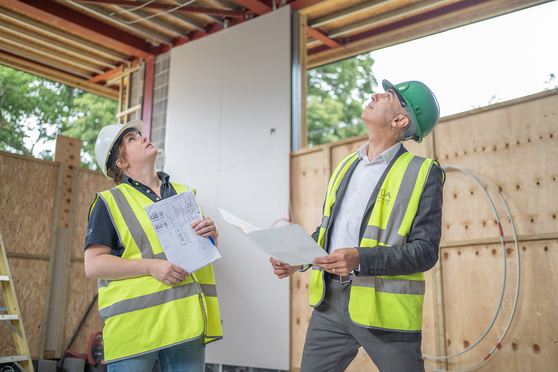 Becky and Matt looking at building on site meeting