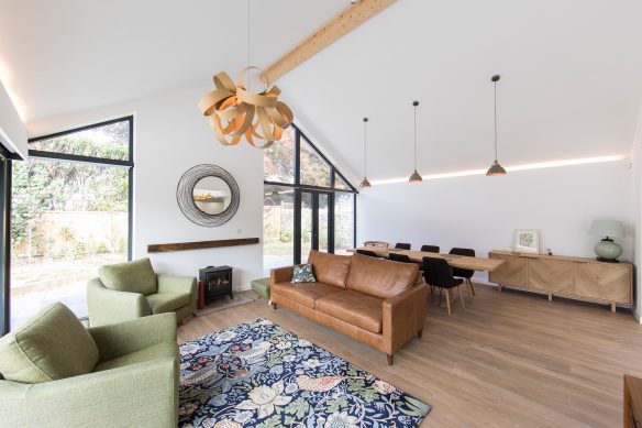 Living area with leather sofa and vaulted ceiling