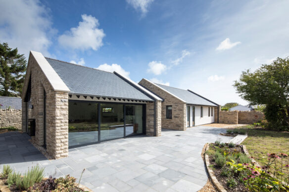 modern stone bungalow with large glazing areas