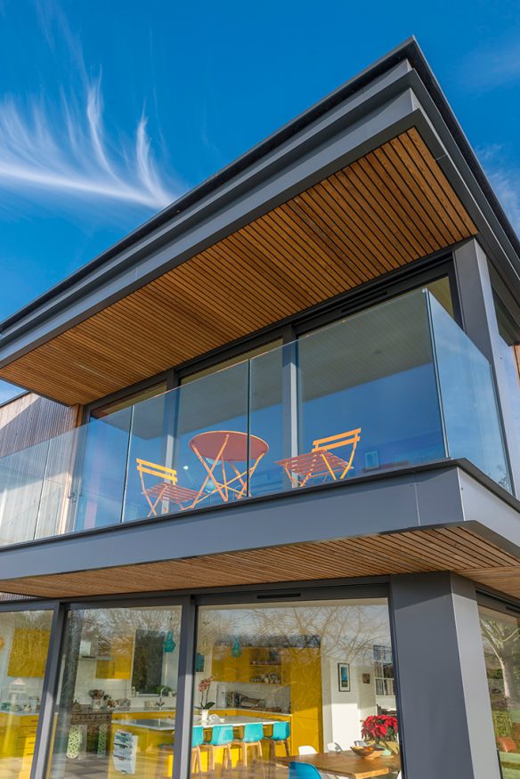 view looking up at a balcony with timber soffit