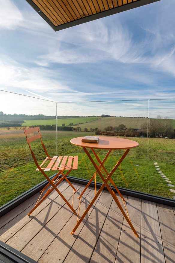 Balcony with orange seating