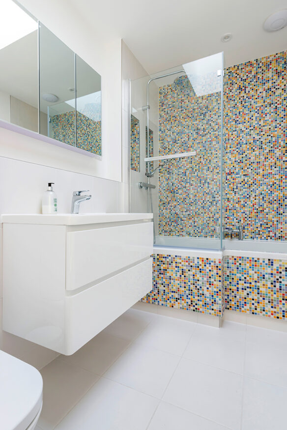 colourful mosaic tiles in white bathroom
