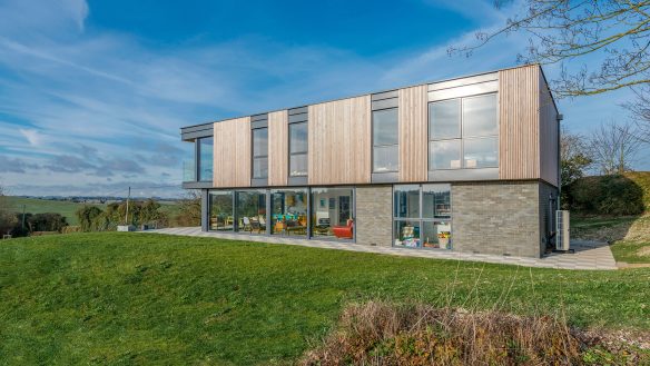 striking elevation of modern countryside house with timber cladding