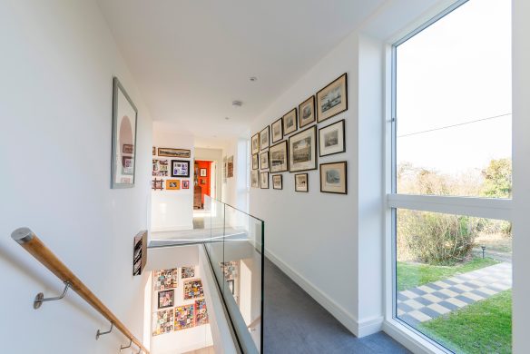 White landing area with glass balustrade