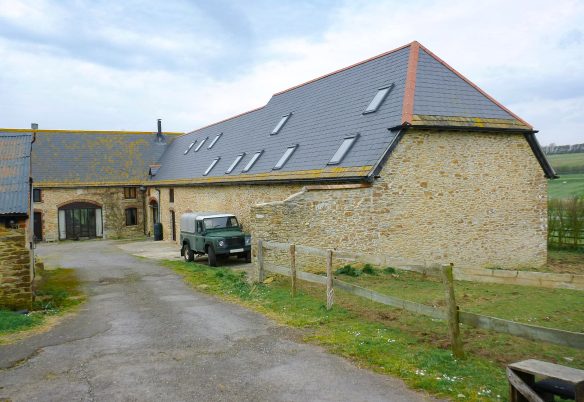 Entrance driveway approaching a stone barn conversion