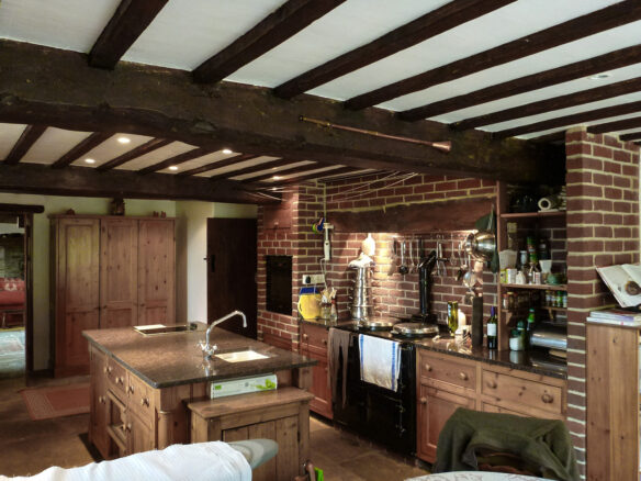 interior of a farmhouse kitchen with exposed beams