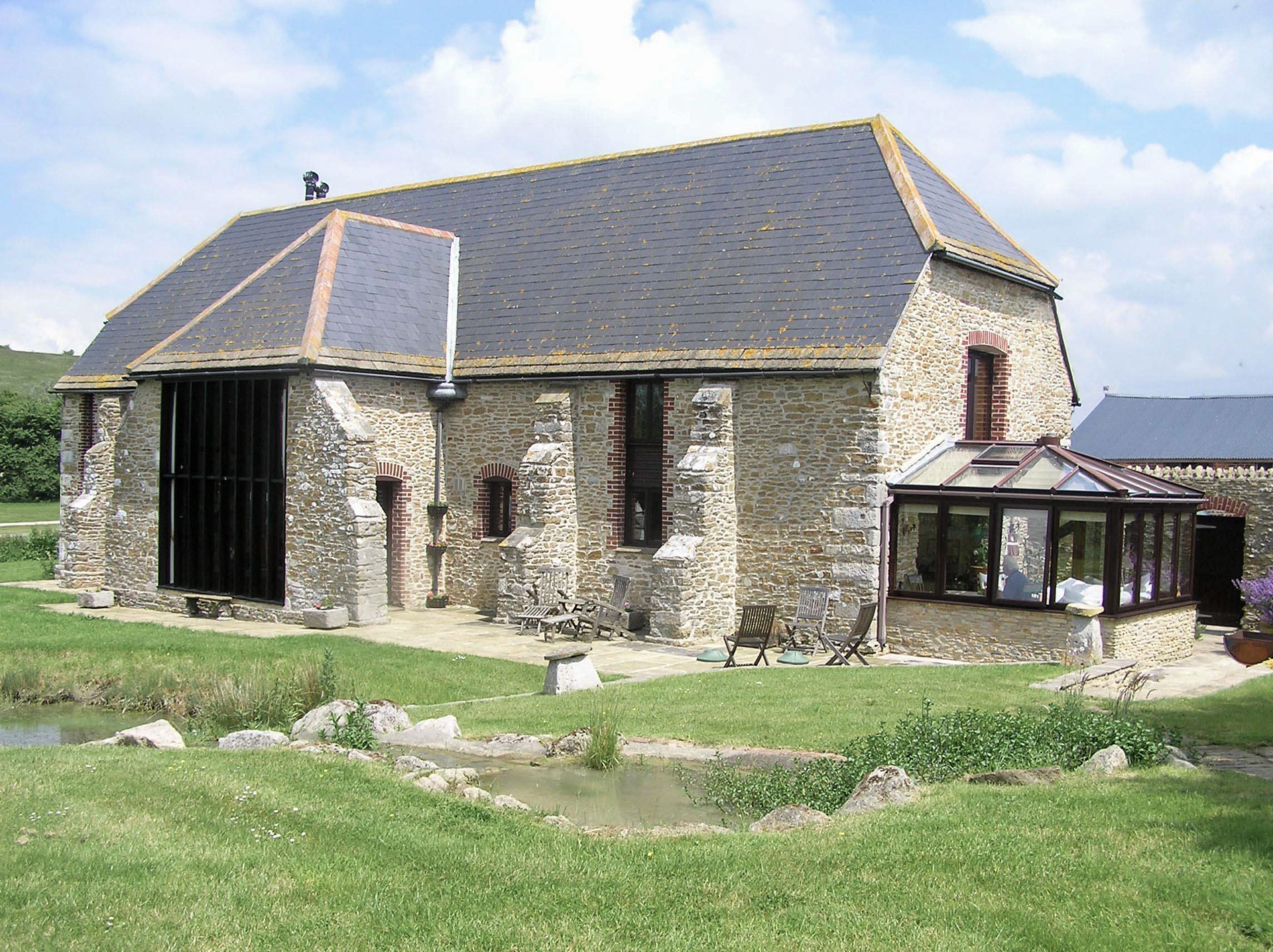 exterior of barn reconstruction with conservatory