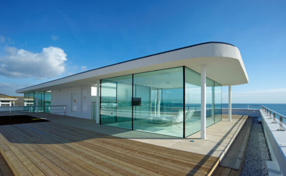 glass pavilion with 'floating' roof, stunning sea views