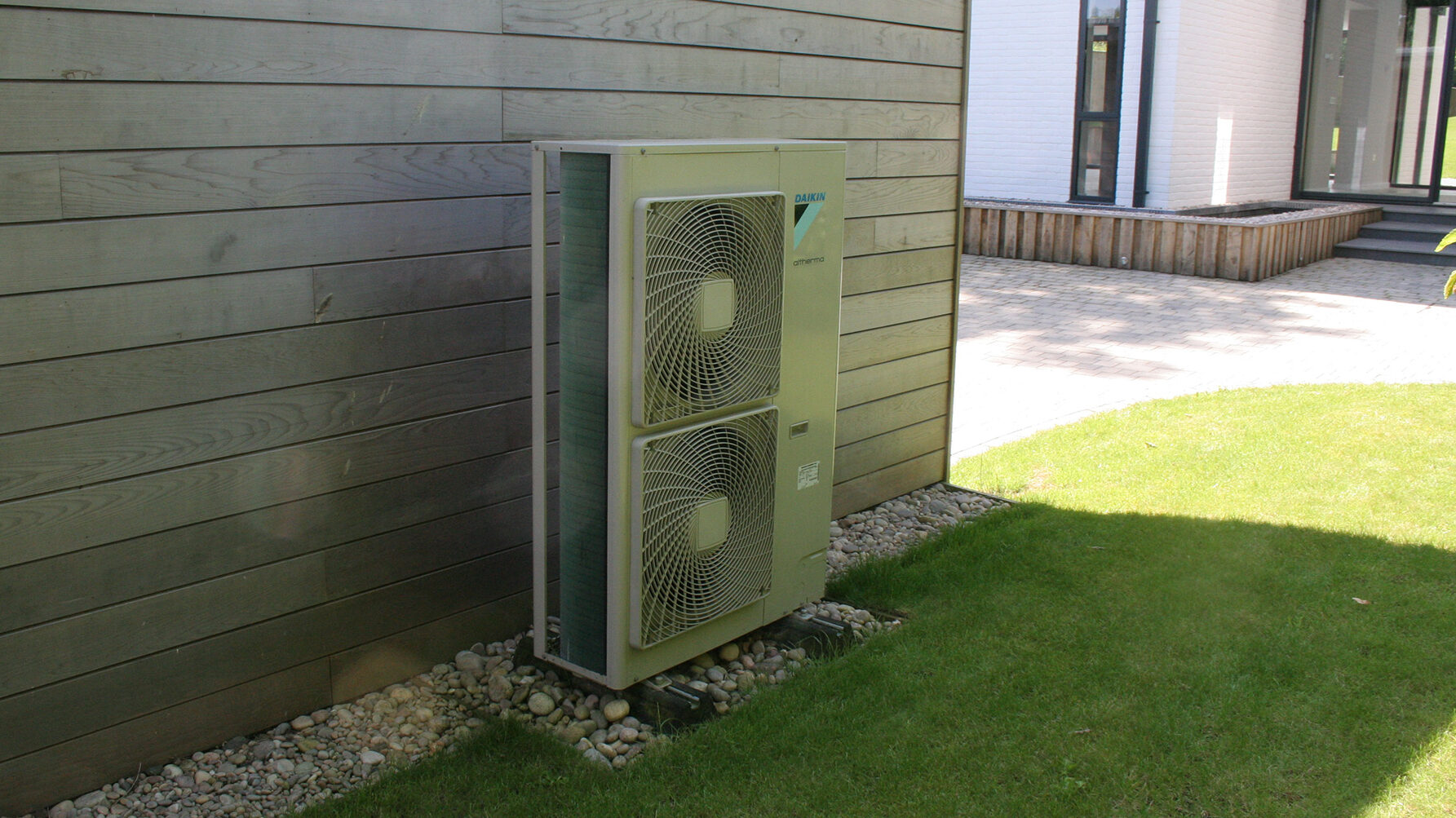 heat pump at the side of timber building