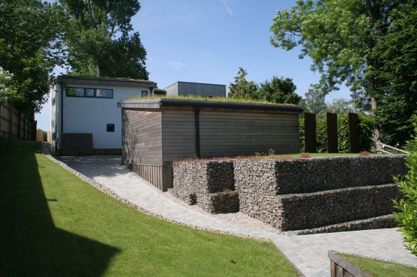 front driveway view of house on sloping terrain