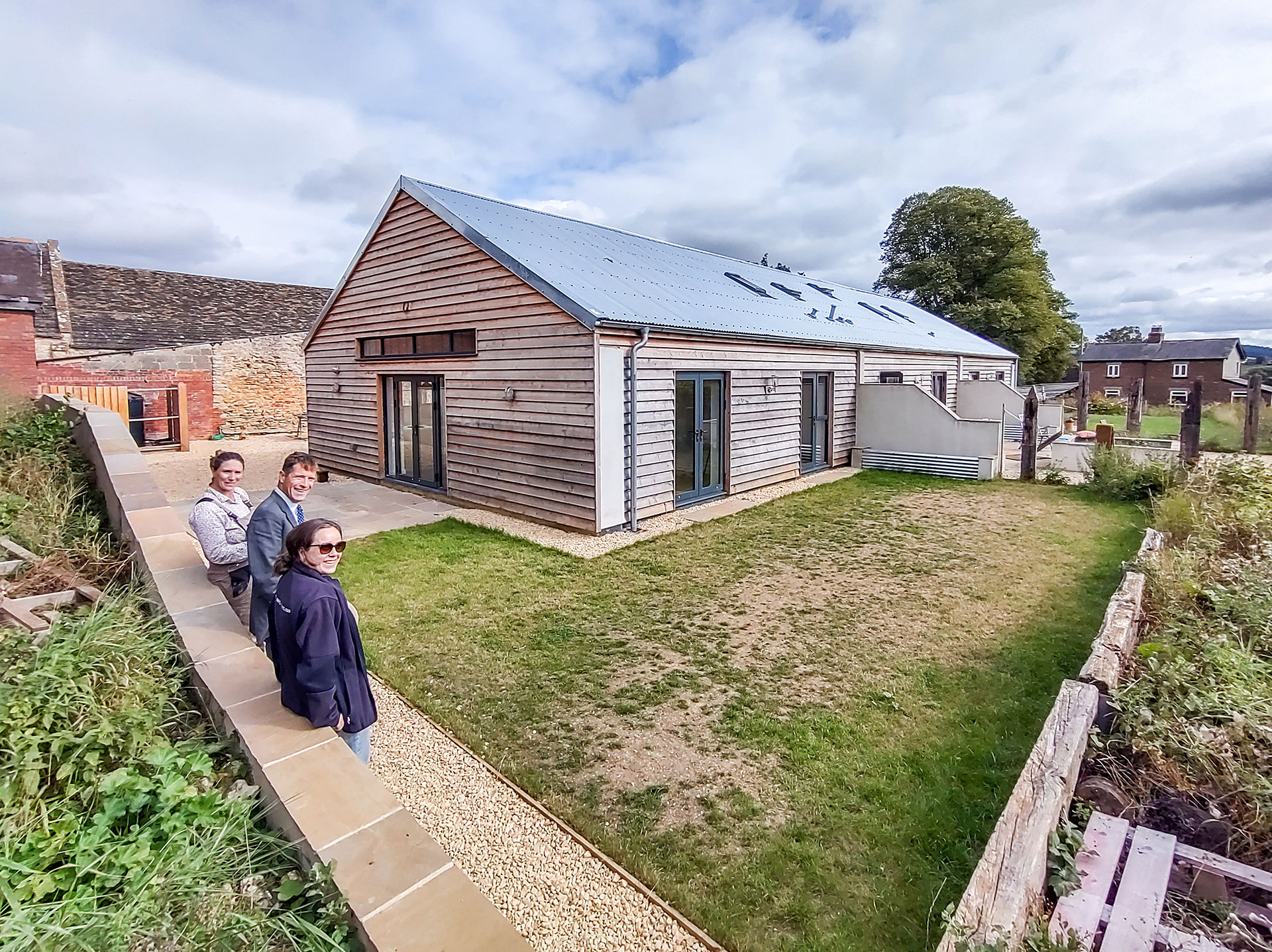 newly converted timber clad barns