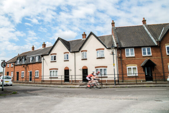 Street view of brick and render attached houses