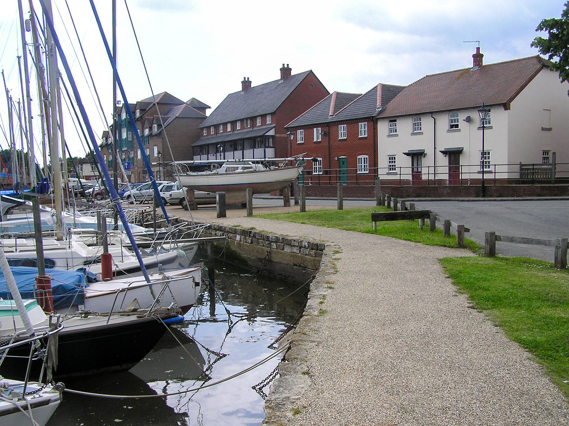 walkway view of historic quayside with red brick houses