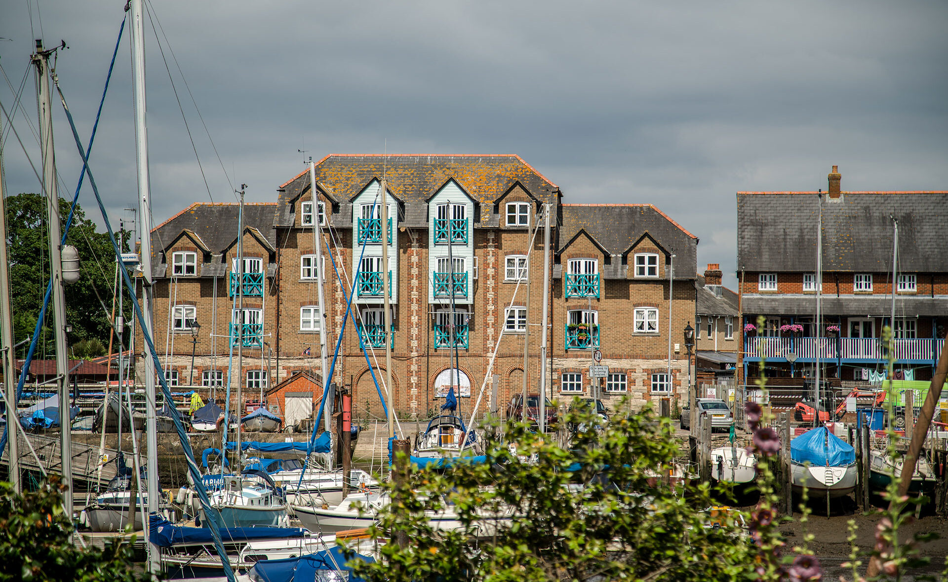 front view of attractive apartments behind quay