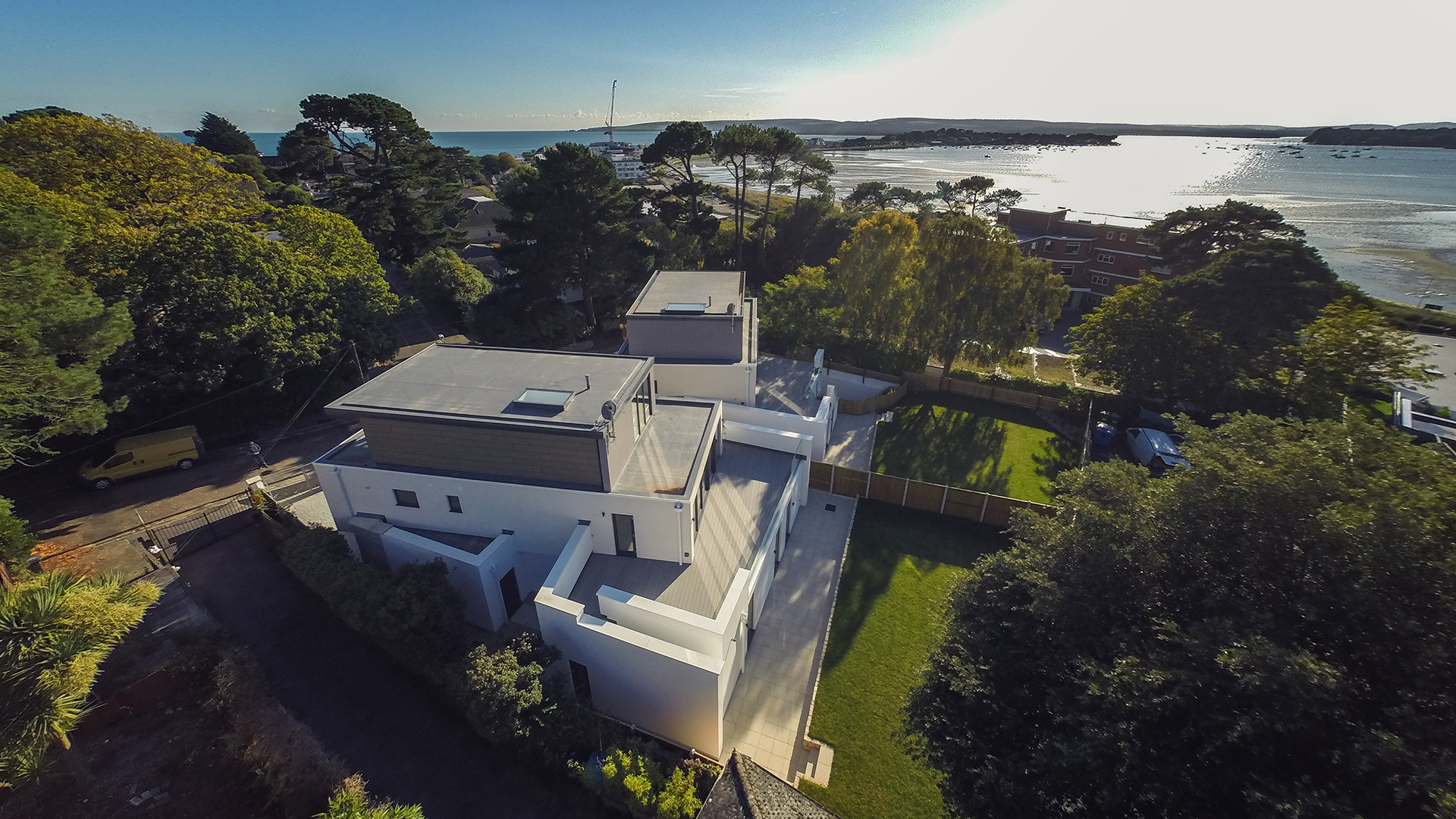 Aerial view of pair of houses near the sea