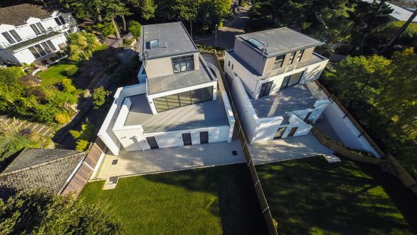 aerial view of pair of houses with large balconies