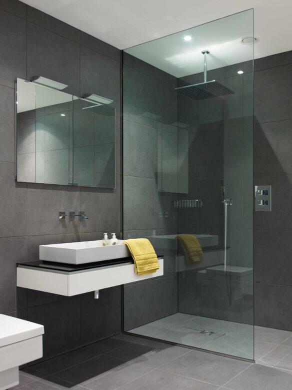 modern wet room with sink and shower, grey and white tones