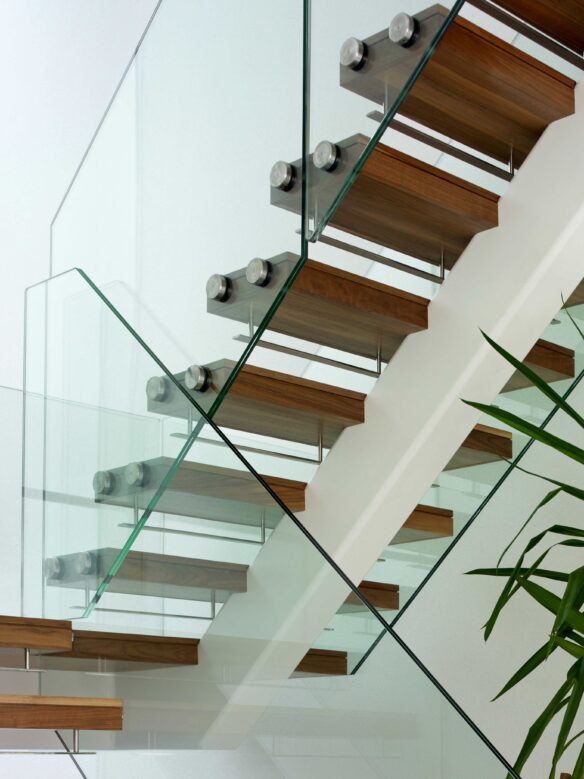 Floating wooden modern staircase with glass sides