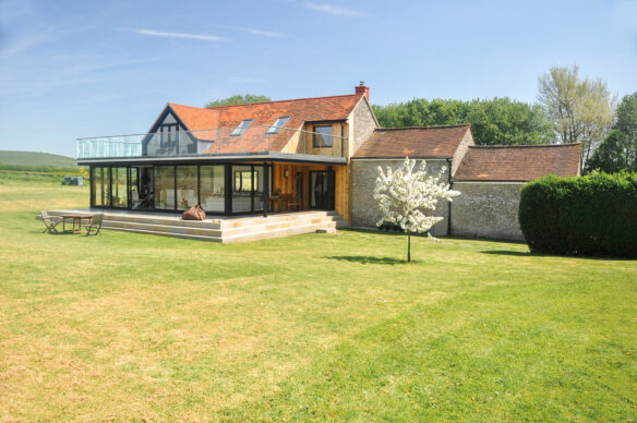 attractive glass extension to farm house
