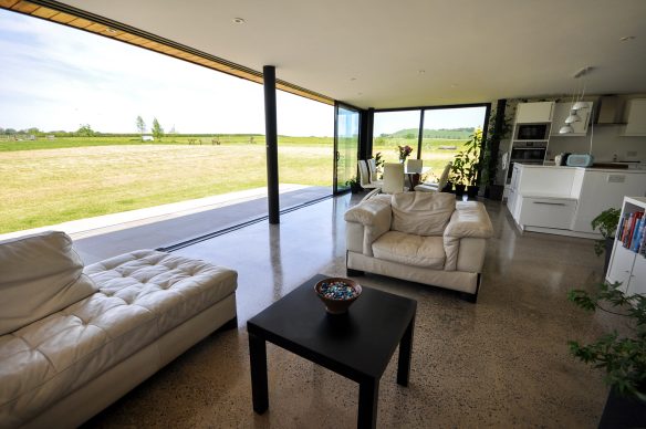 Living room with sliding glass wall