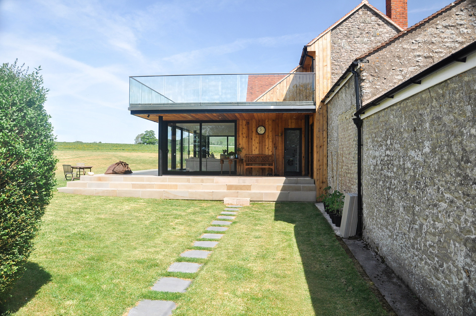 Side of new glass extension on farm house