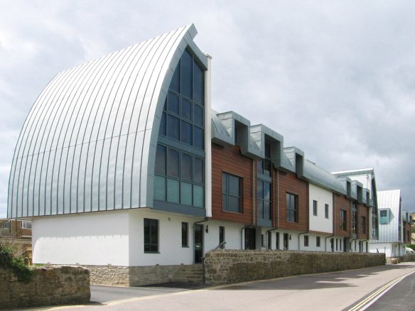 street view of apartment building with curved roof