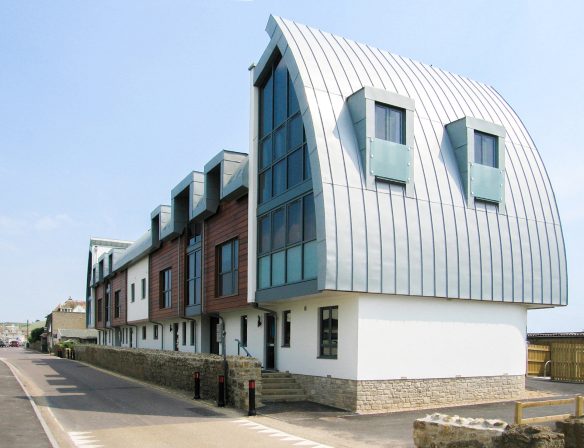 side view of building with unique curved roof