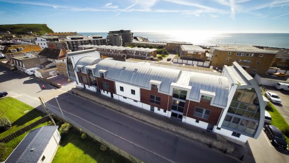 Striking curved roof apartments