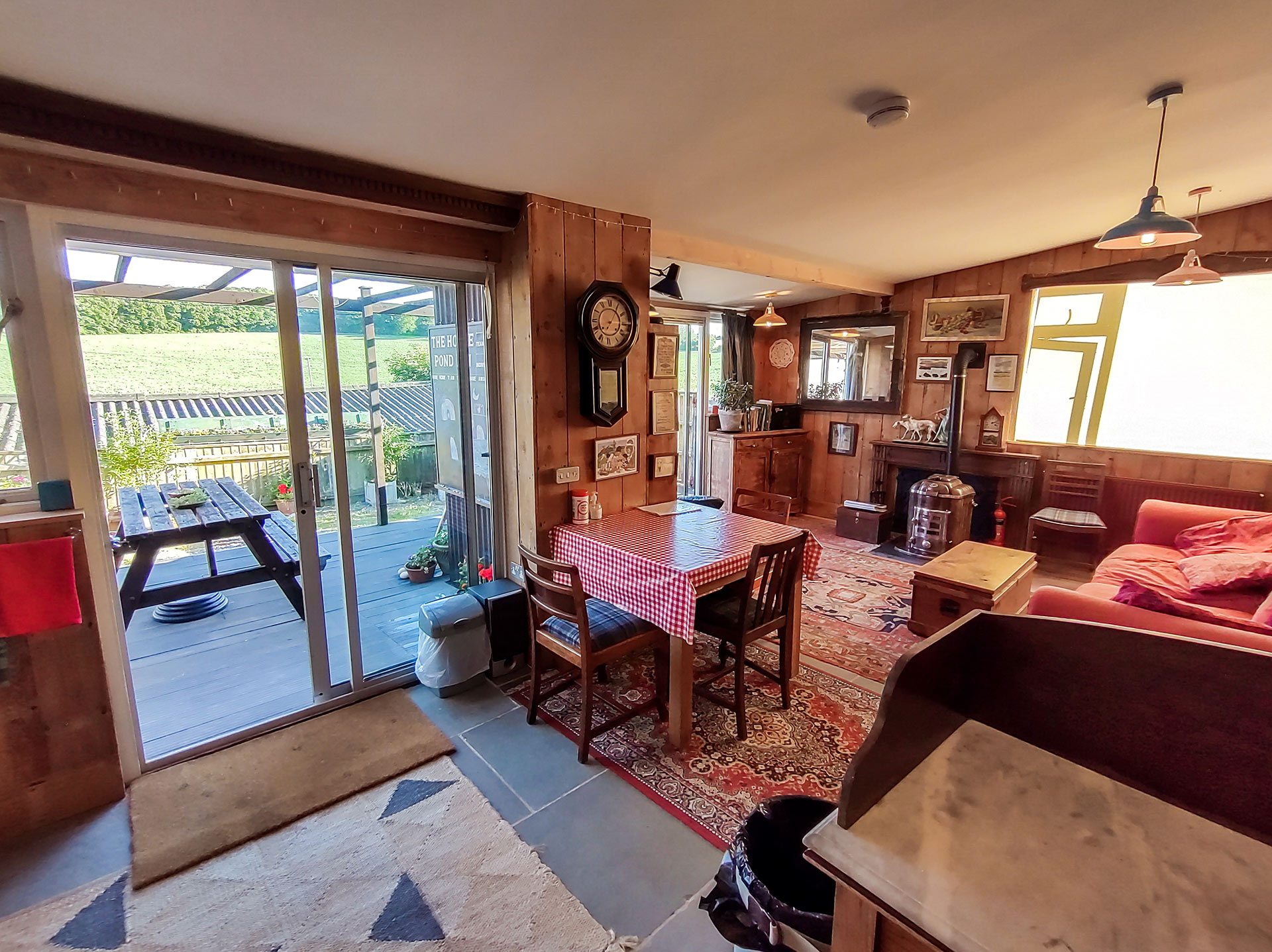 Open plan interior with wooden paneling on wall