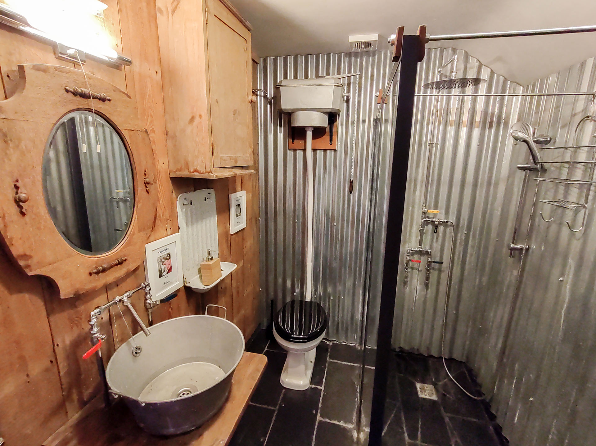 Shower room with corrugated iron sheet