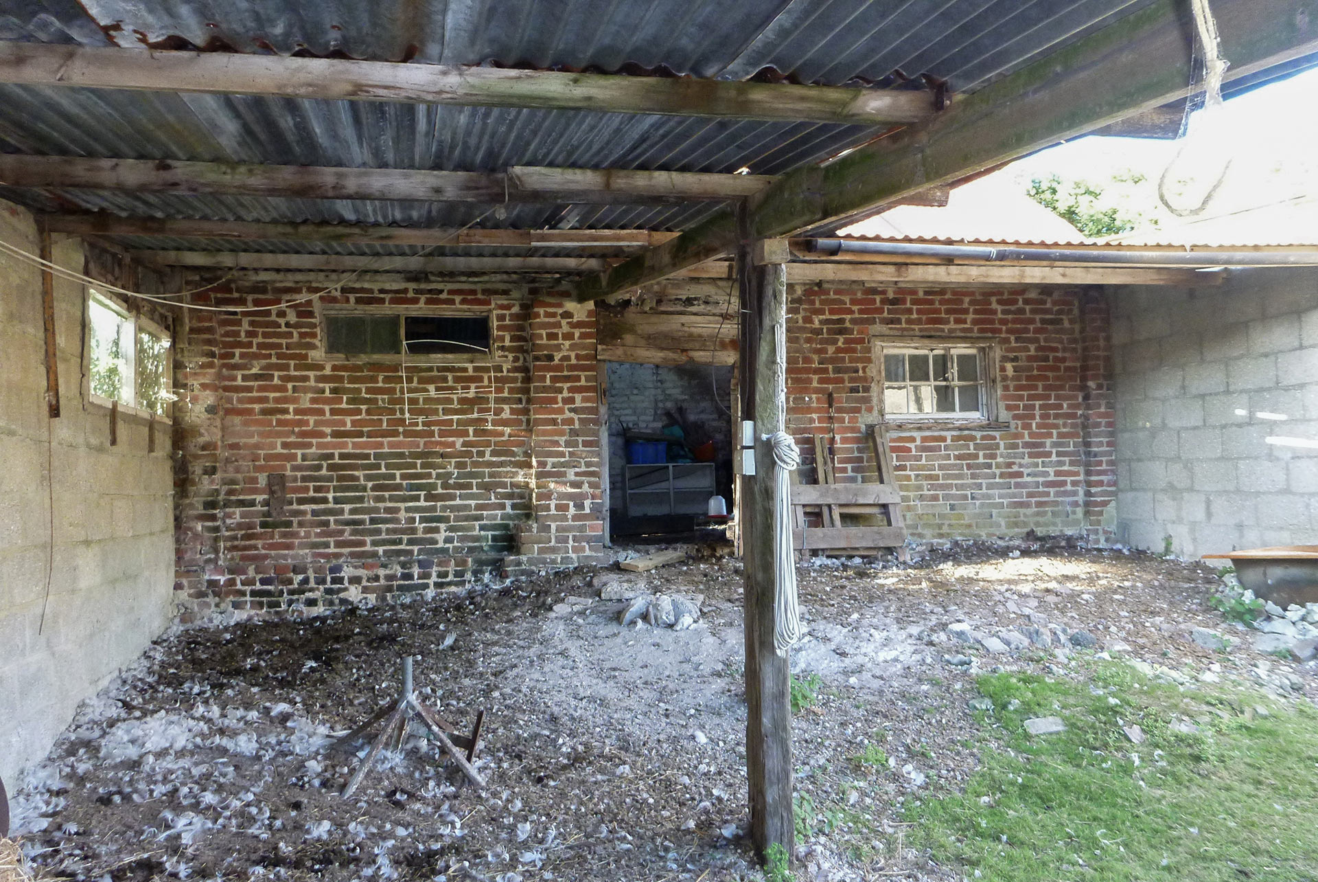 the dilapidated barn before conversion