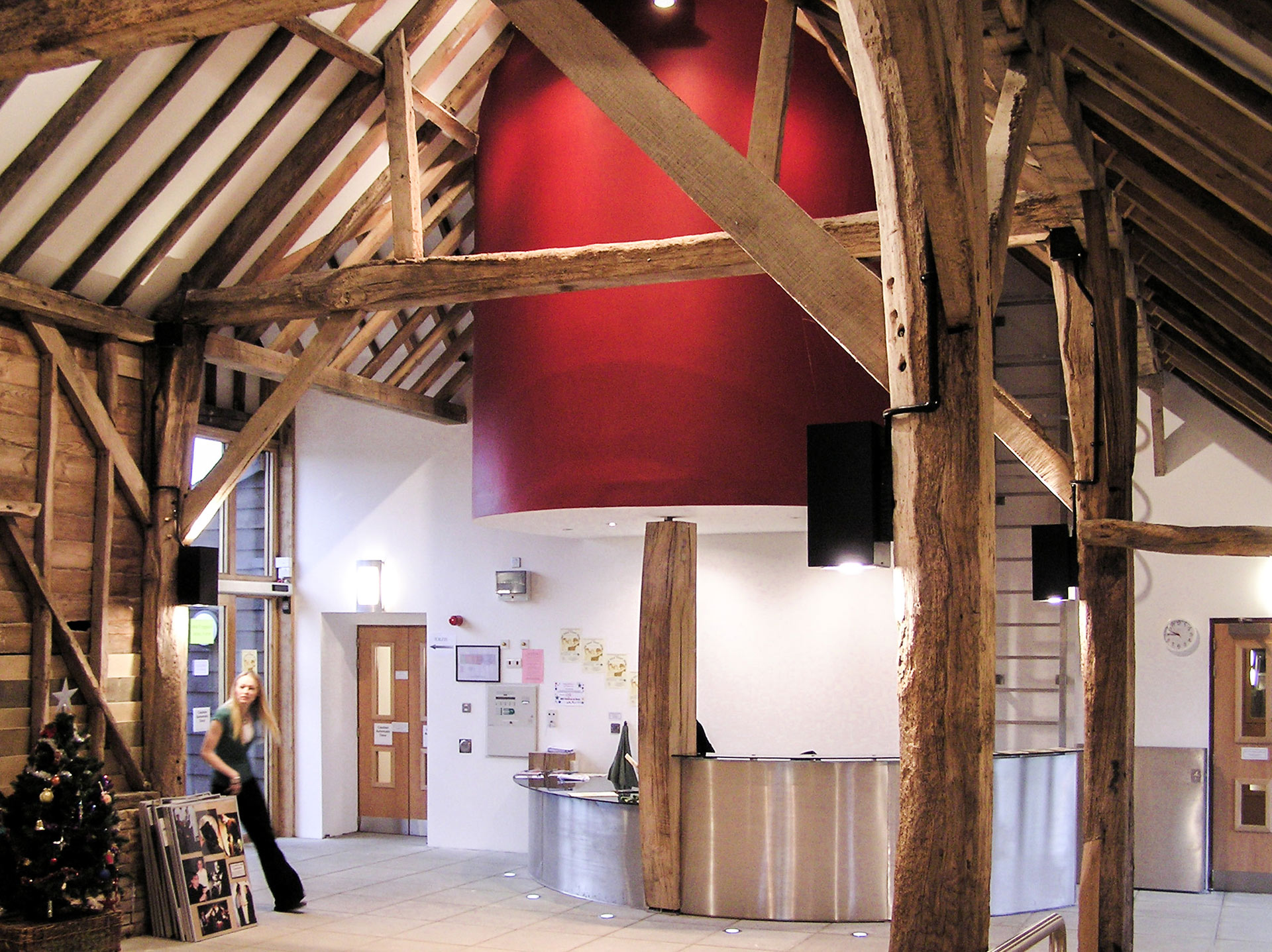 interior large entrance space with exposed beams and modern desk