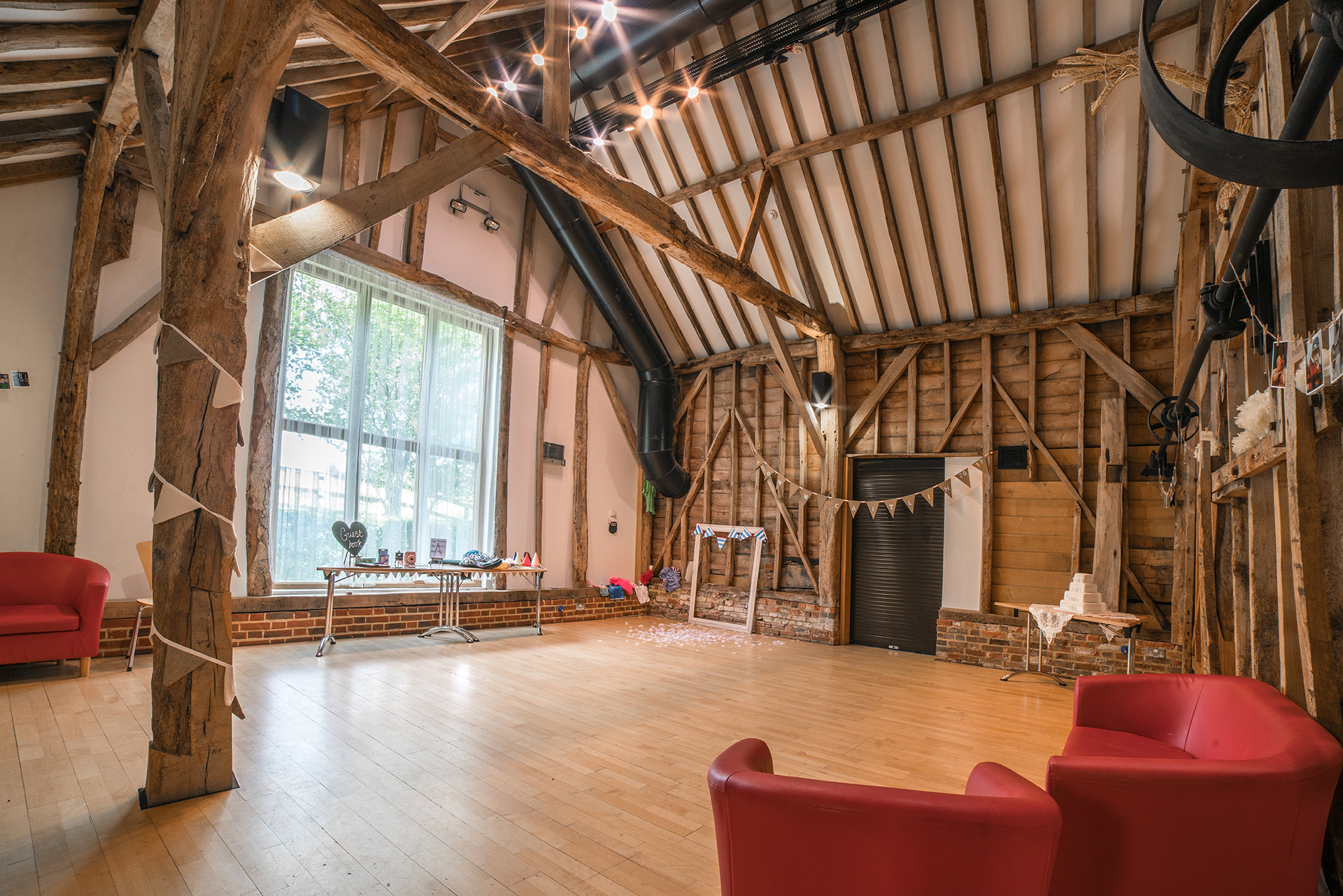 interior of studio space with exposed beams and wood paneling