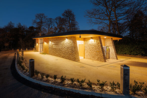 Side view of Upton House Country Park welcome centre at dusk