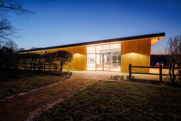 side view of welcome centre at duck with sloping roof and wooden paneling on external walls