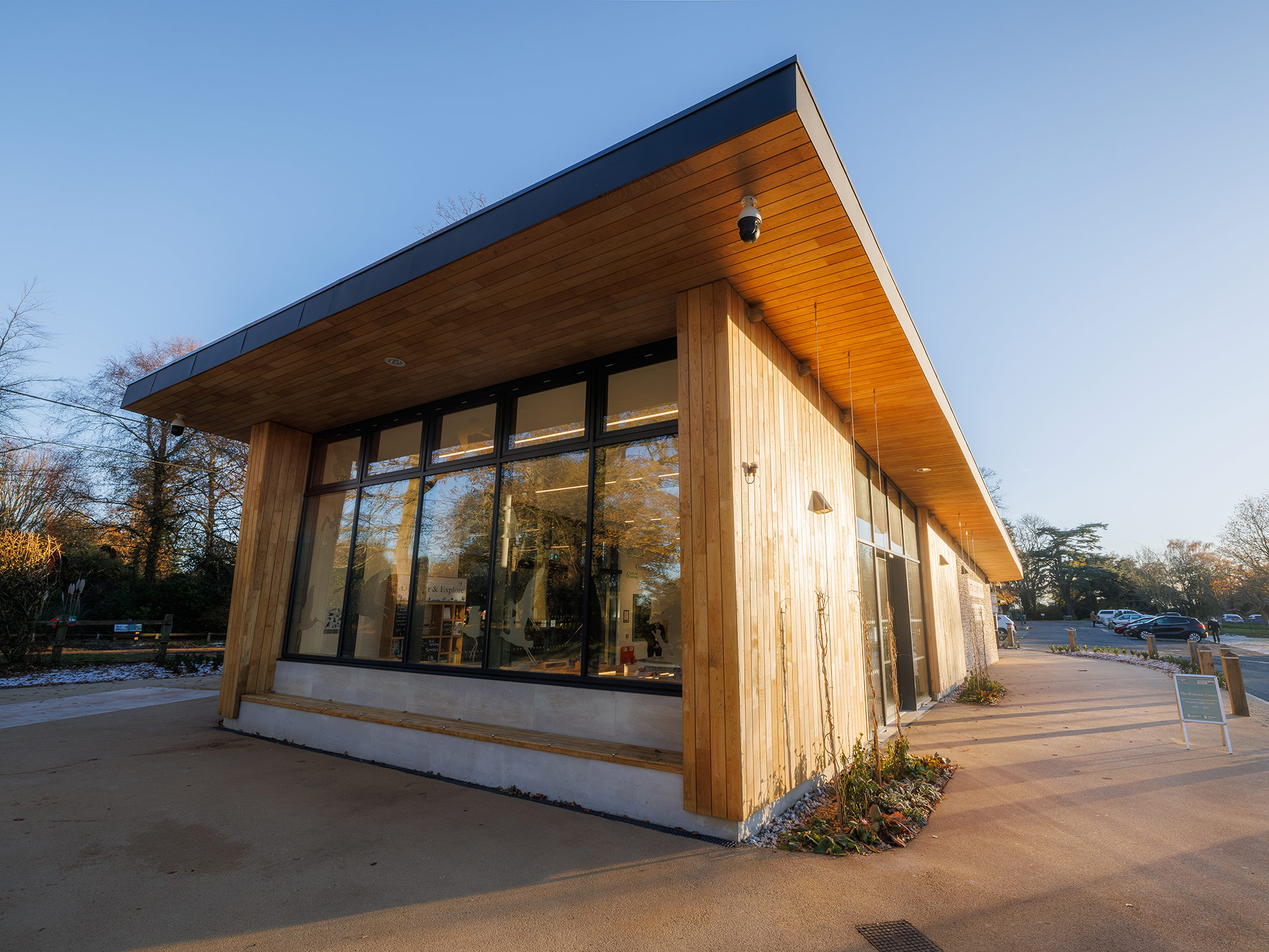 front view of welcome centre with wooden cladding and large window feature wall