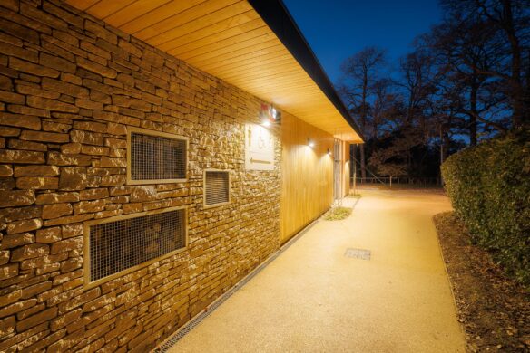 close up of welcome centre stone wall at dusk