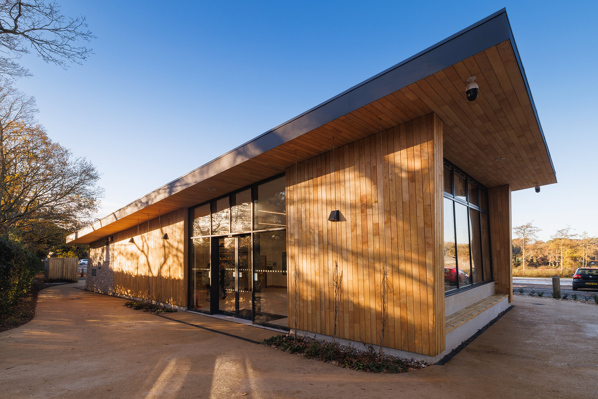 front and side view of welcome centre with wood cladding