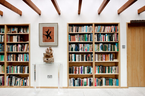 interior bookshelf built into wall with exposed beams
