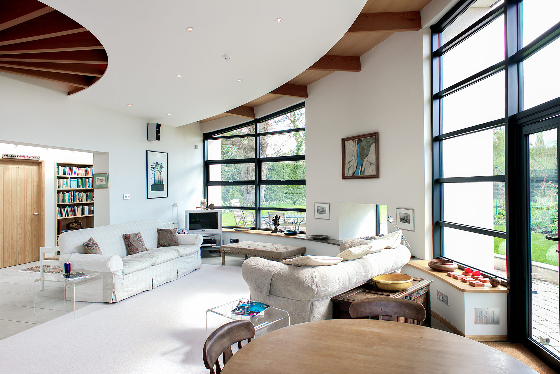 living space with curved white walls
