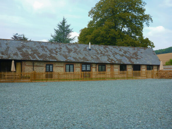 front view of finished barn conversion with parking space infront